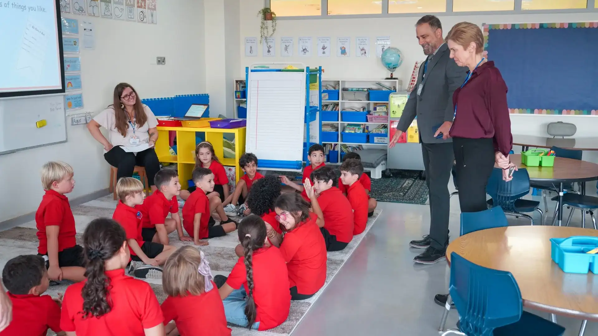 AISJ adults and students gathered in a supervised classroom setting